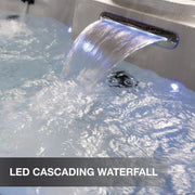 LED cascading waterfall feature in a hot tub with water flowing down.