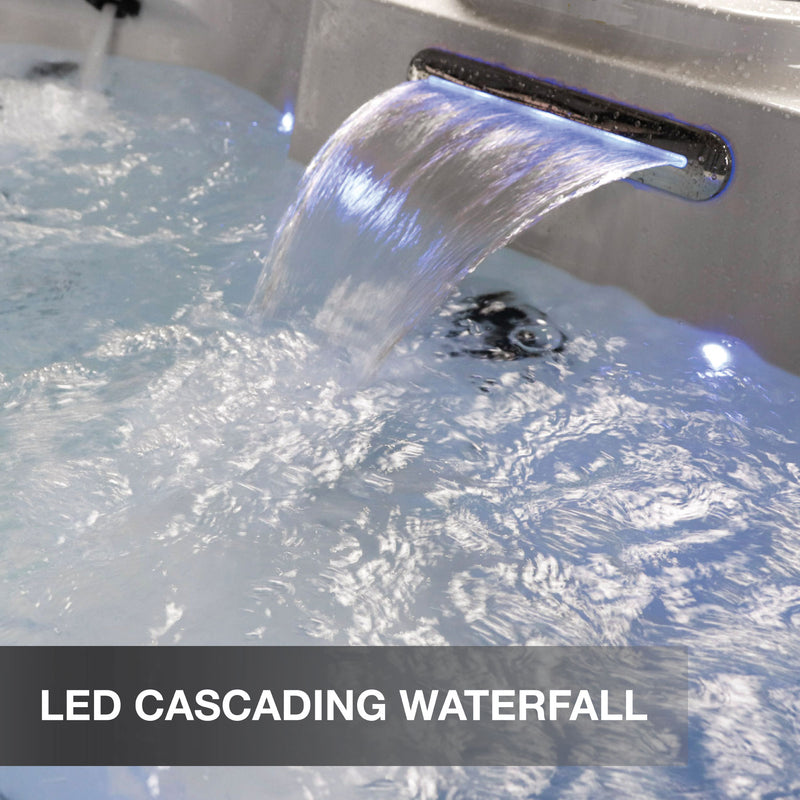 LED cascading waterfall feature in a hot tub with water flowing down.